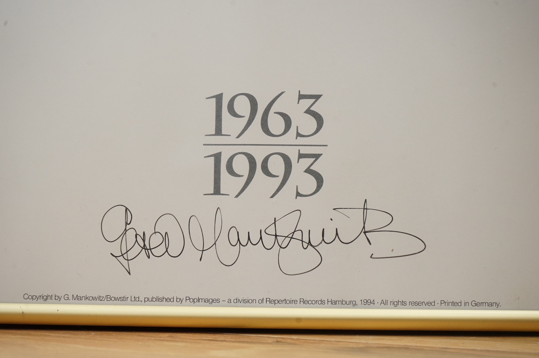 Jimi Hendrix interest; a framed signed poster by Gered Mankowitz of Jimi Hendrix, Mason’s Yard Studio, London, 1967, printed in 1994, signed by Mankowitz at the bottom of the image, 83 x 58.5cm